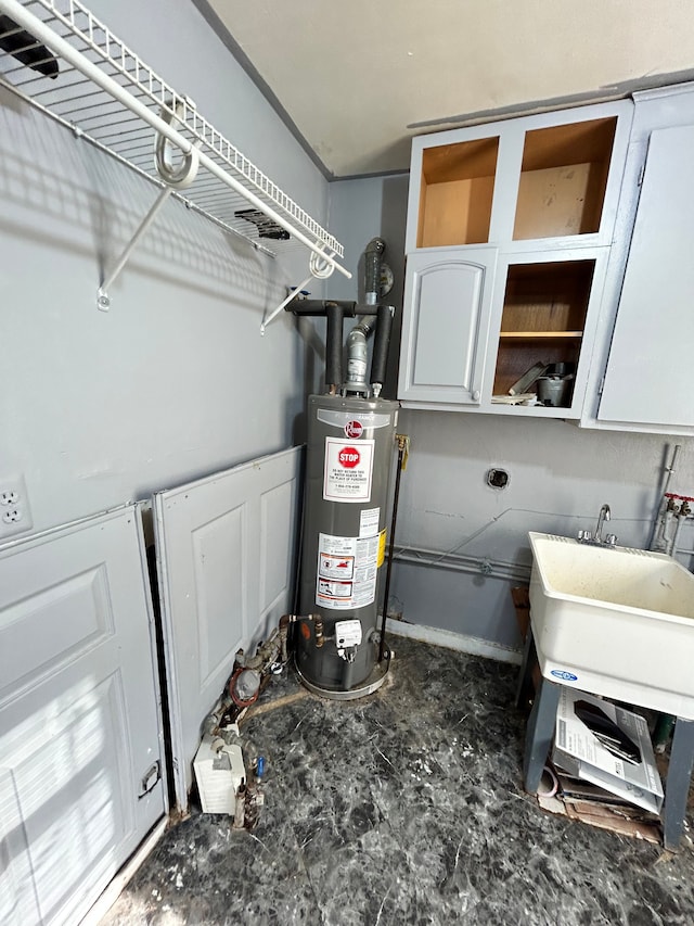 utilities featuring sink and gas water heater