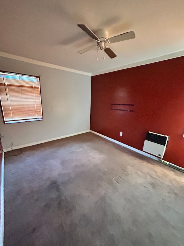 spare room featuring ornamental molding and ceiling fan