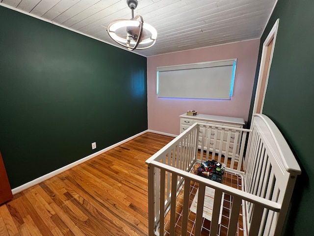 stairs featuring wood ceiling and wood-type flooring