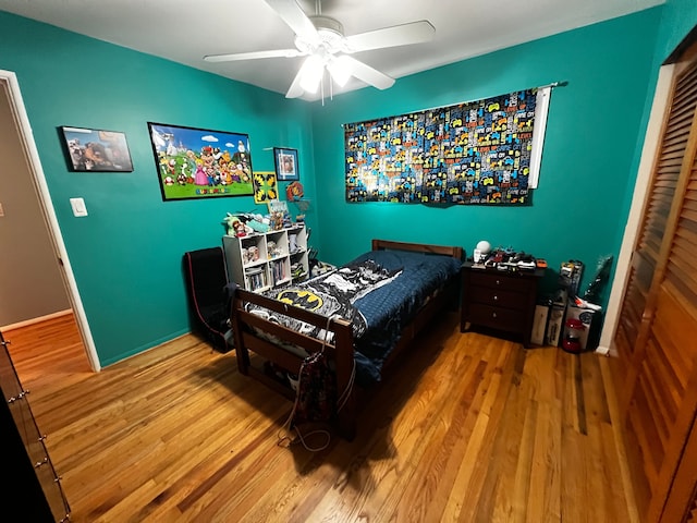 bedroom featuring hardwood / wood-style floors and ceiling fan