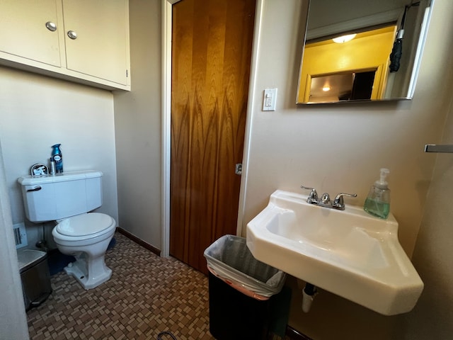 bathroom with sink and toilet