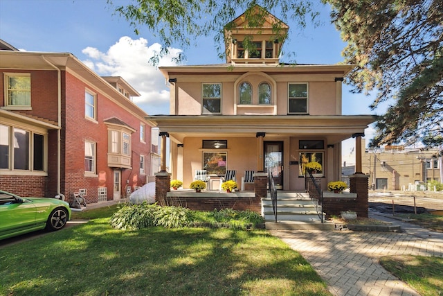 view of front of home featuring a front yard and a porch