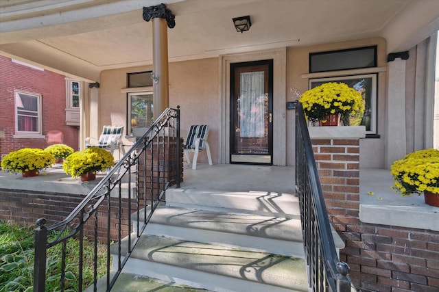 entrance to property featuring a porch