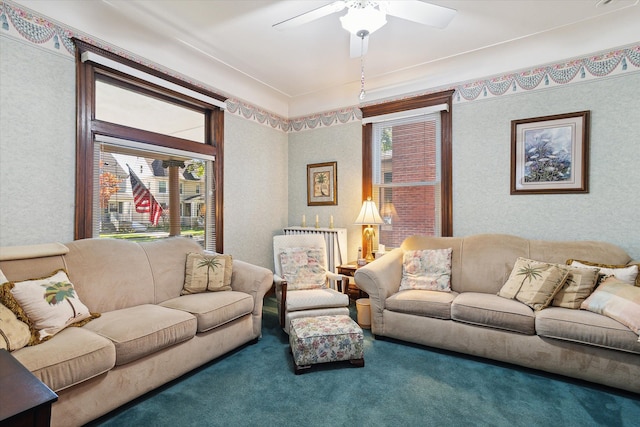 living room featuring plenty of natural light, carpet flooring, and ceiling fan