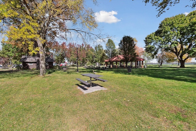 surrounding community featuring a gazebo and a lawn