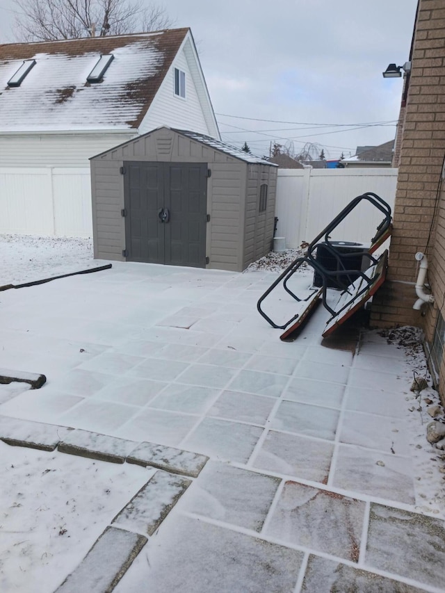 view of shed with a fenced backyard