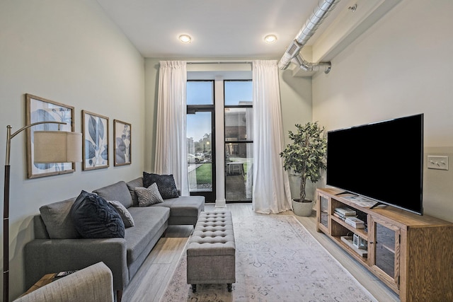 living room with light hardwood / wood-style floors