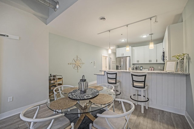 dining area featuring dark hardwood / wood-style flooring