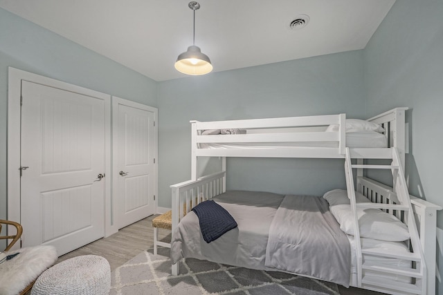 bedroom with light hardwood / wood-style floors