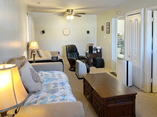 bedroom featuring ceiling fan and light colored carpet