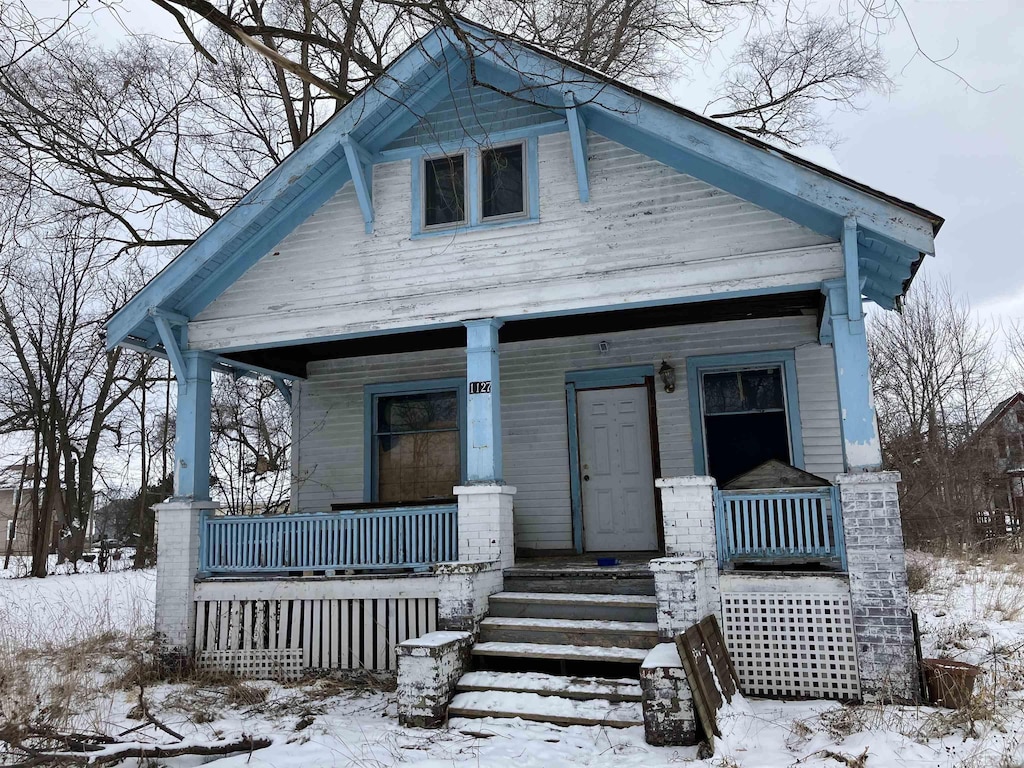 bungalow-style home featuring a porch