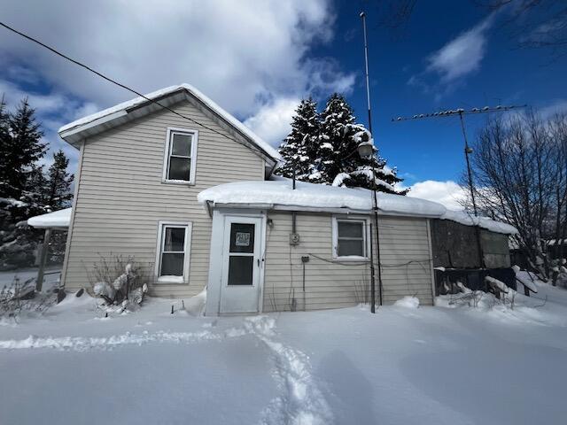 view of snow covered house