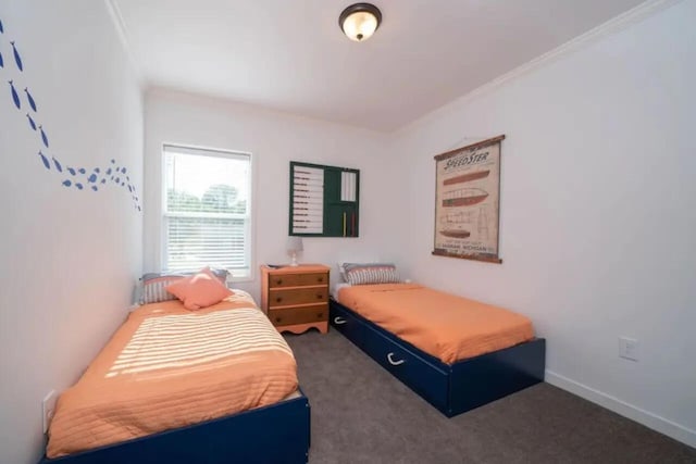 bedroom featuring dark carpet and crown molding