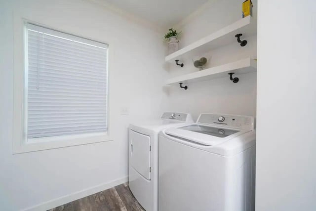 laundry room featuring separate washer and dryer and dark wood-type flooring