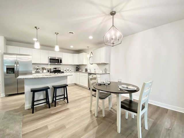 dining area featuring light hardwood / wood-style flooring