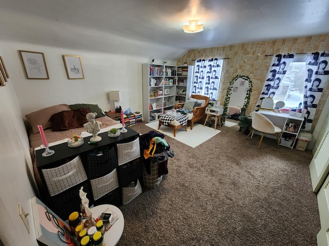 interior space featuring carpet flooring and vaulted ceiling