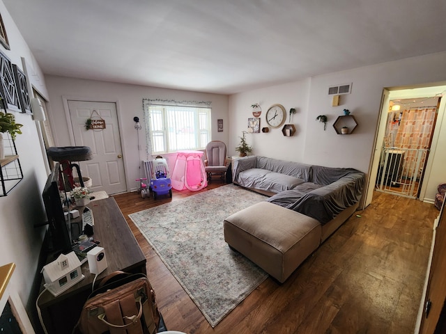 living room with dark hardwood / wood-style flooring