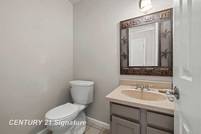 bathroom featuring tile patterned floors, toilet, and vanity