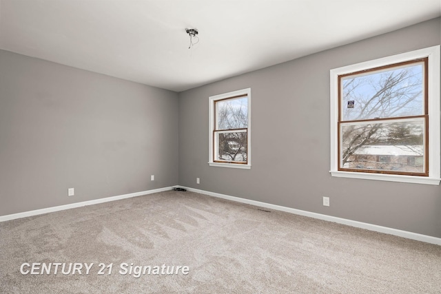 spare room featuring carpet flooring