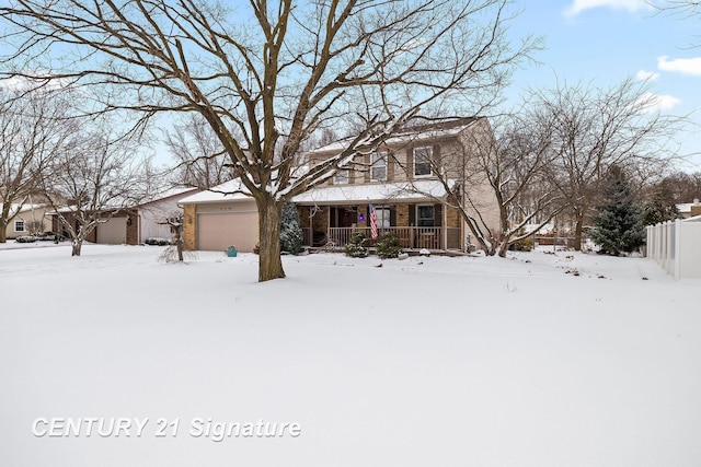 view of front of property with a garage and a porch