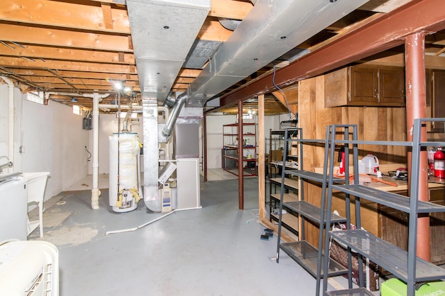 basement featuring heating unit and gas water heater