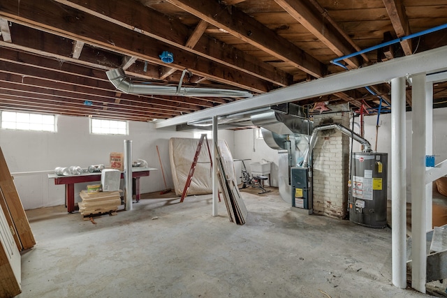 basement with gas water heater and heating unit