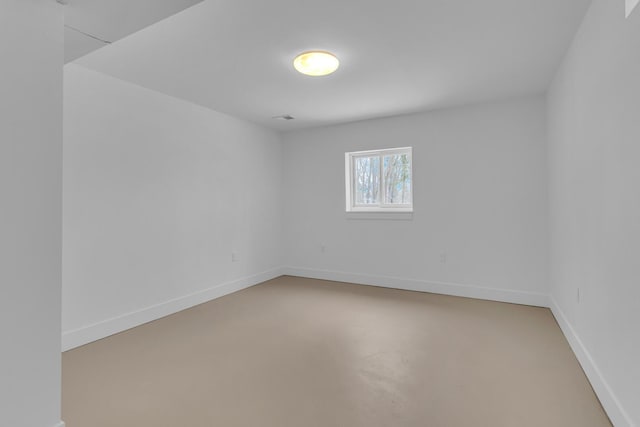 spare room with concrete flooring