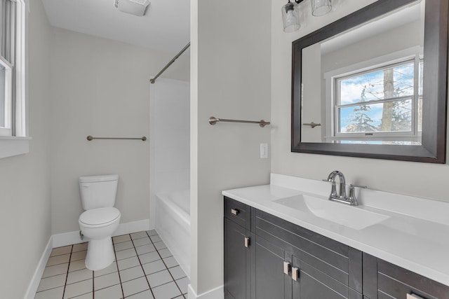 full bathroom with washtub / shower combination, tile patterned floors, toilet, and vanity