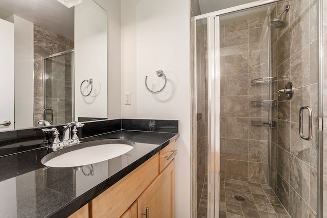 bathroom with vanity and an enclosed shower