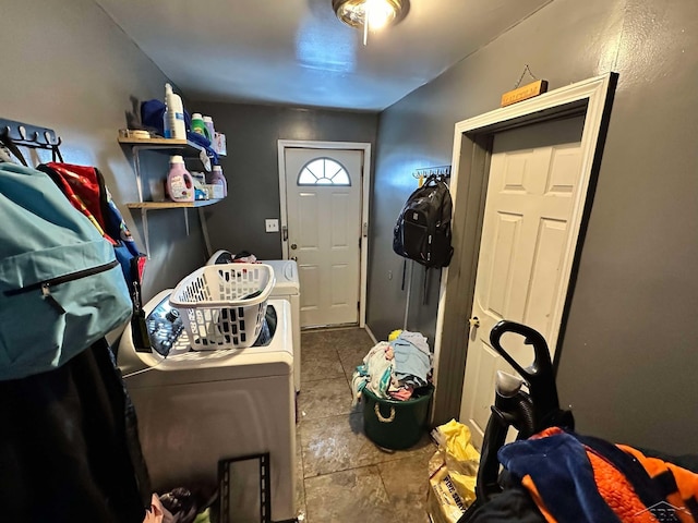 laundry room featuring washer and clothes dryer and light tile patterned floors