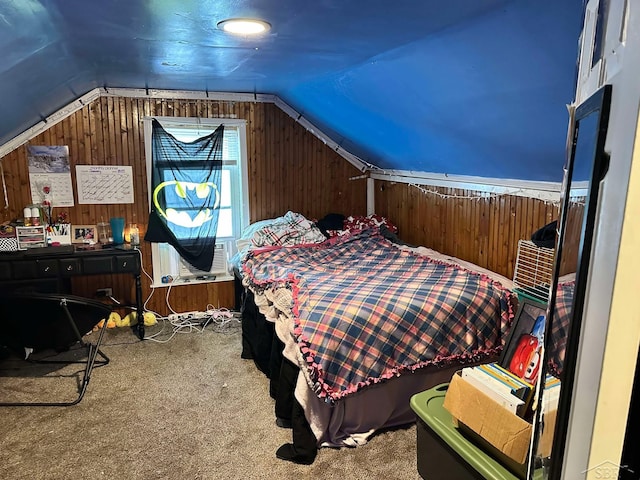 bedroom featuring lofted ceiling, wooden walls, and carpet