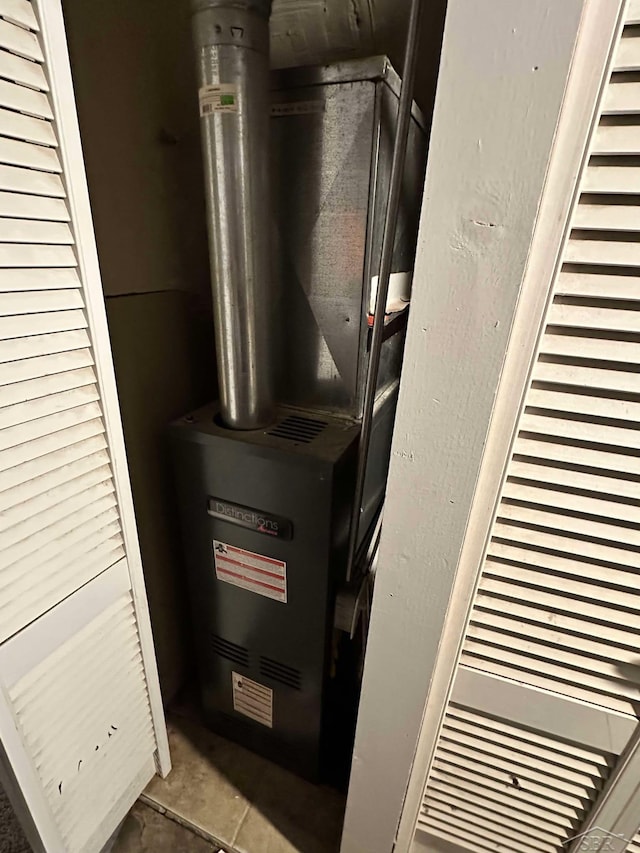 utility room with heating unit