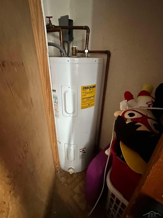 utility room with electric water heater