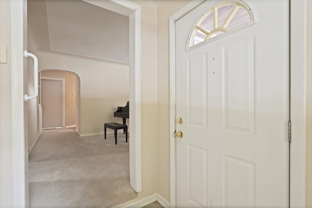 view of carpeted foyer