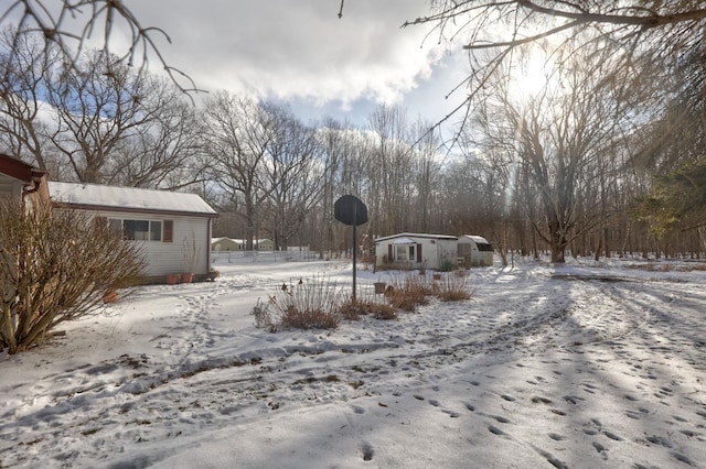 view of yard covered in snow