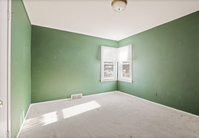 empty room featuring carpet flooring