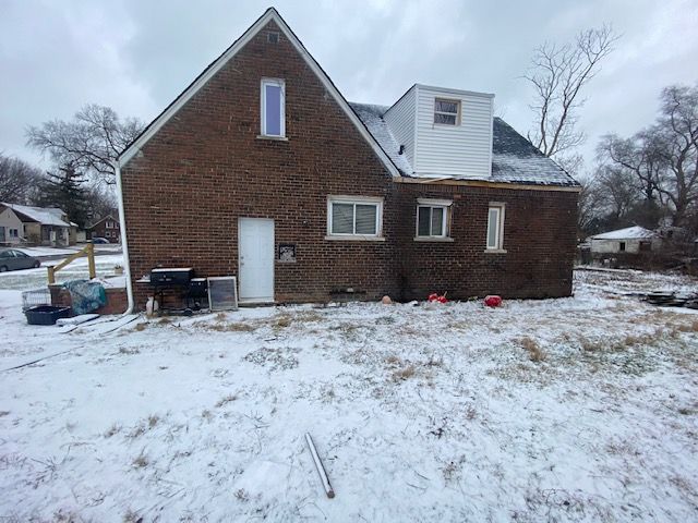 view of snow covered house