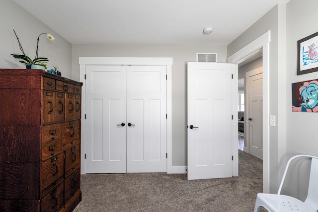 carpeted bedroom with a closet