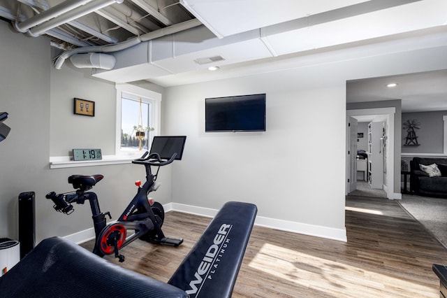 exercise area with wood-type flooring