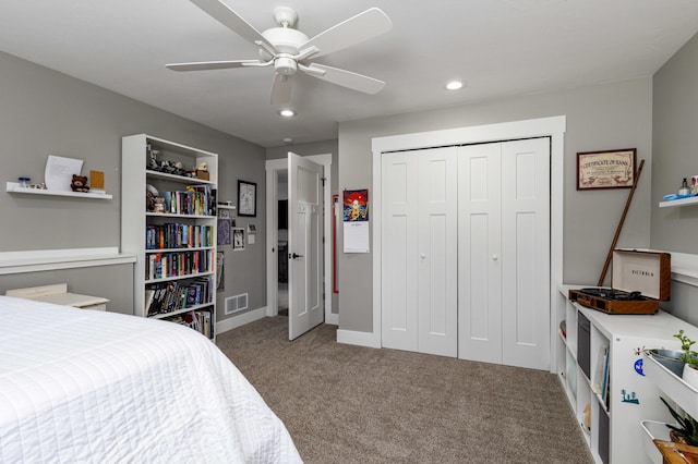 bedroom featuring ceiling fan, carpet flooring, and a closet