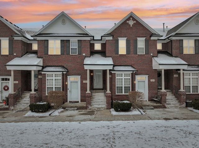 view of front of house with brick siding