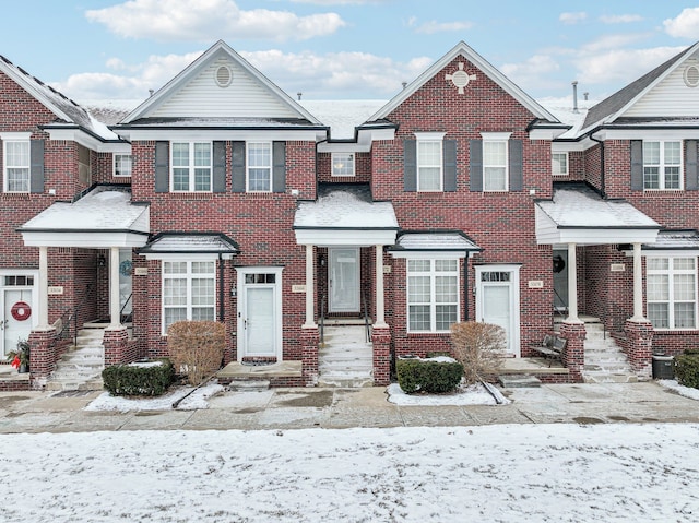 view of property featuring brick siding