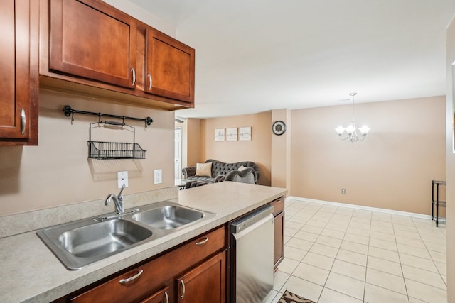 kitchen with light countertops, stainless steel dishwasher, pendant lighting, a sink, and light tile patterned flooring