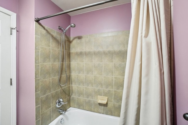 bathroom with shower / bath combination with curtain