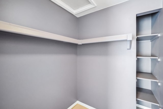 walk in closet with attic access