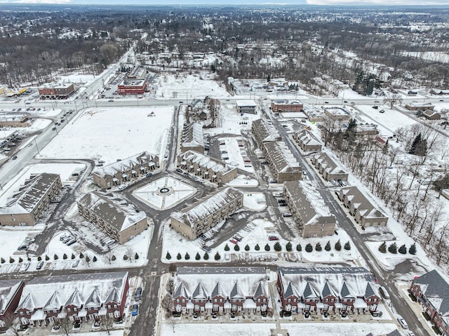 snowy aerial view with a residential view