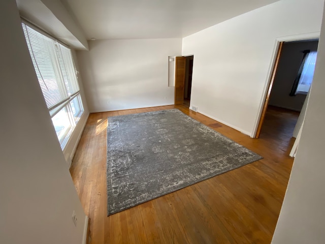 unfurnished room featuring wood-type flooring