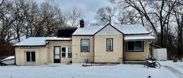 view of snow covered house