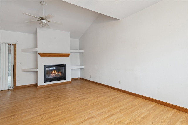 unfurnished living room with built in shelves, ceiling fan, lofted ceiling, and light wood-type flooring