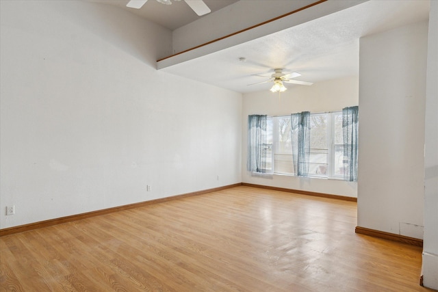 unfurnished room with ceiling fan and light wood-type flooring